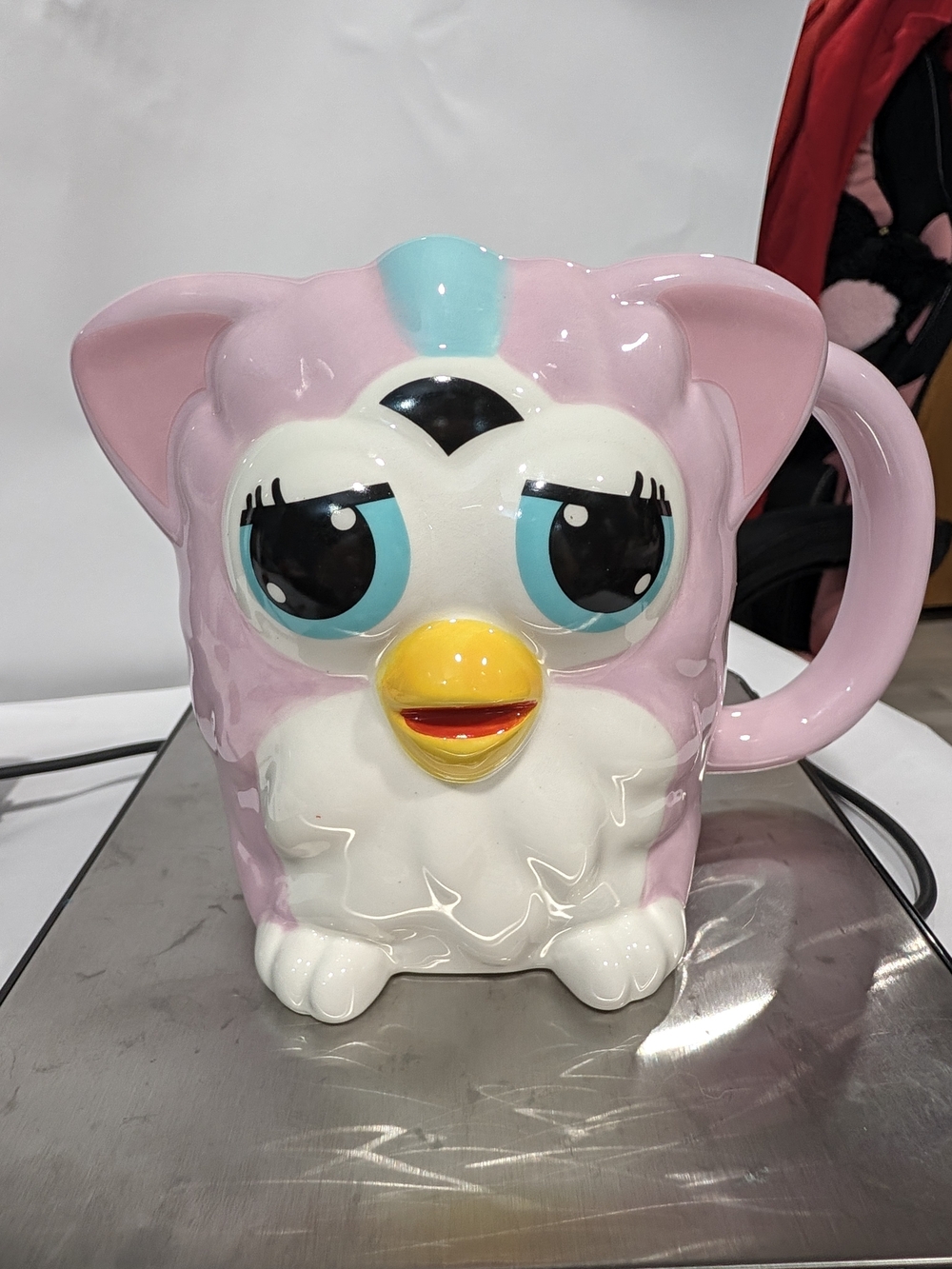 Pink Character Ceramic Mug with Blue and Yellow Accents